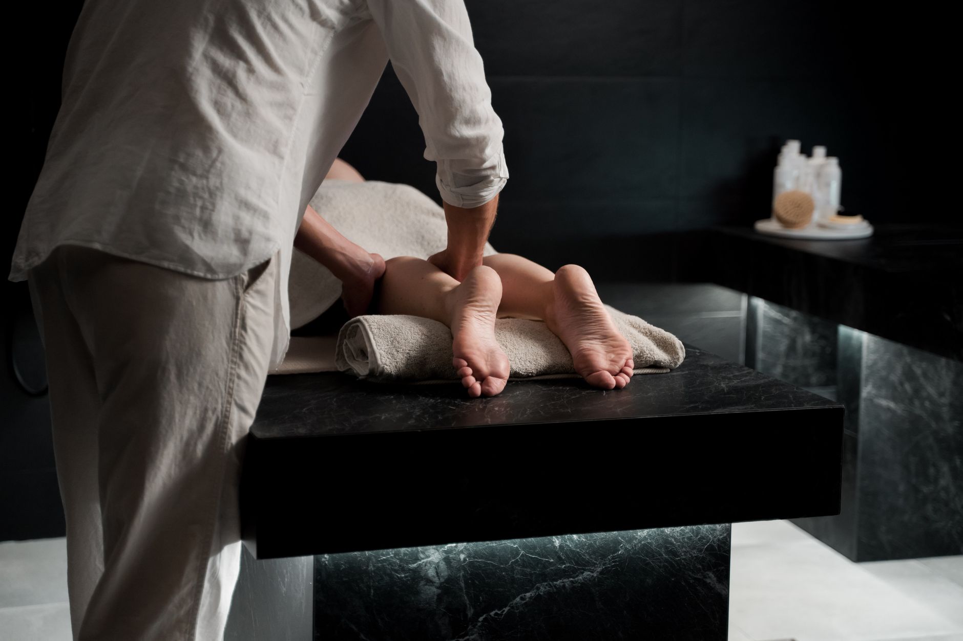 Hands massaging a person's feet